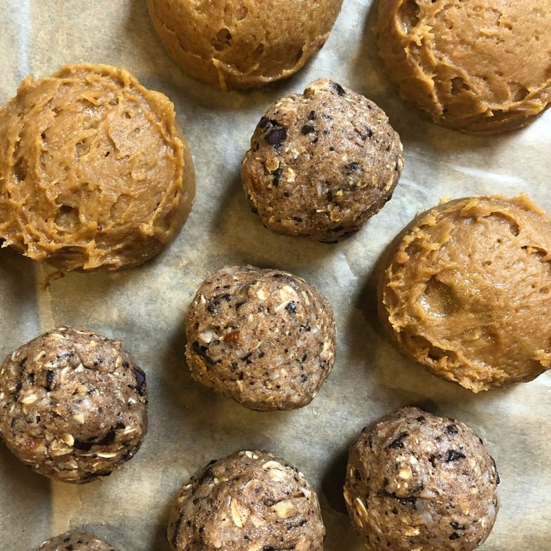Cookie dough scooped onto parchment