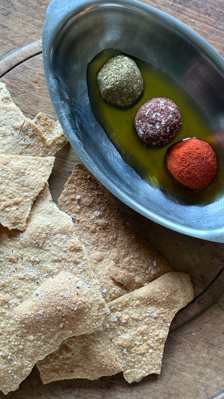 Labneh balls in olive oil with sourdough crackers
